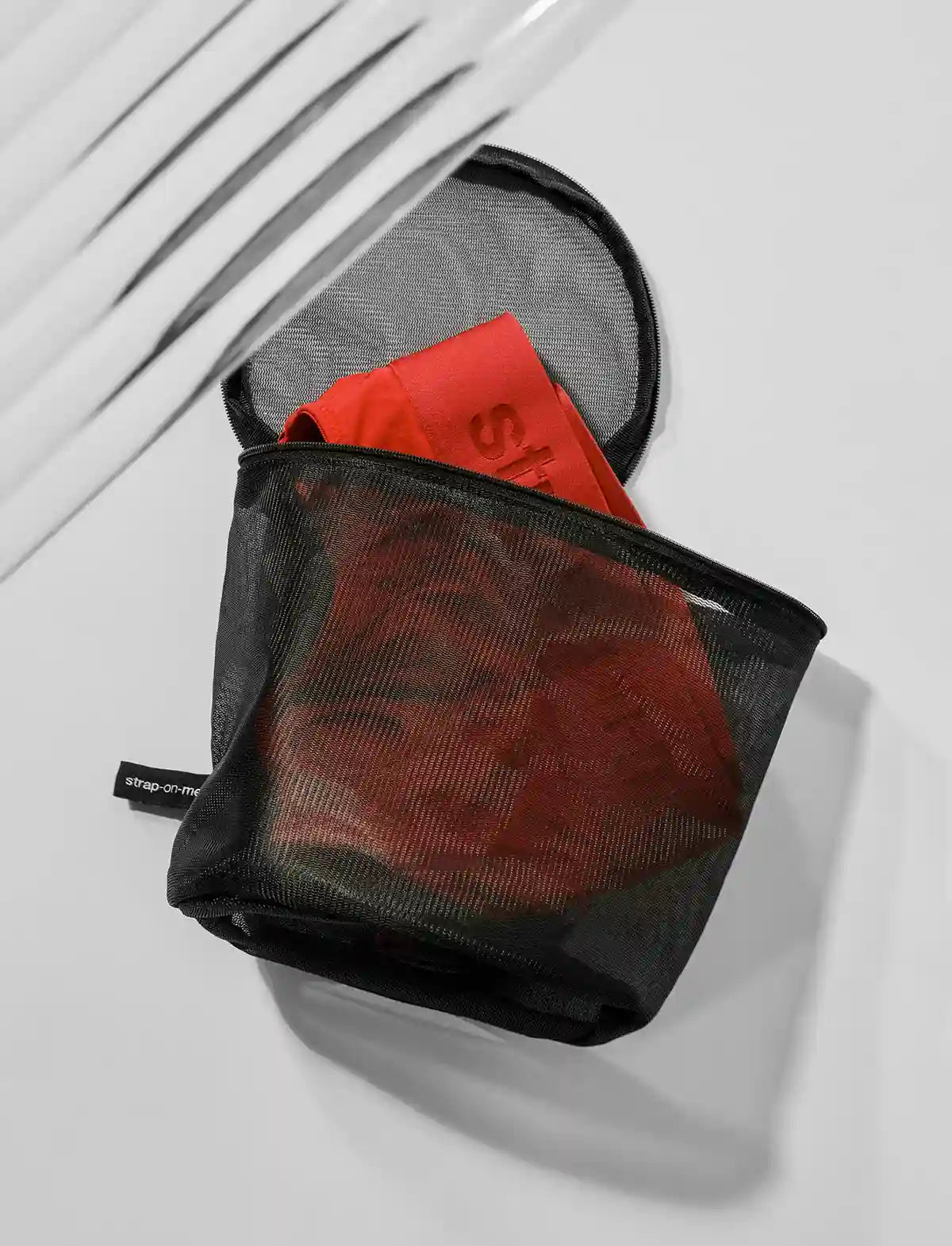 Strap-on-Me wash pouch for discreet storage and product protection