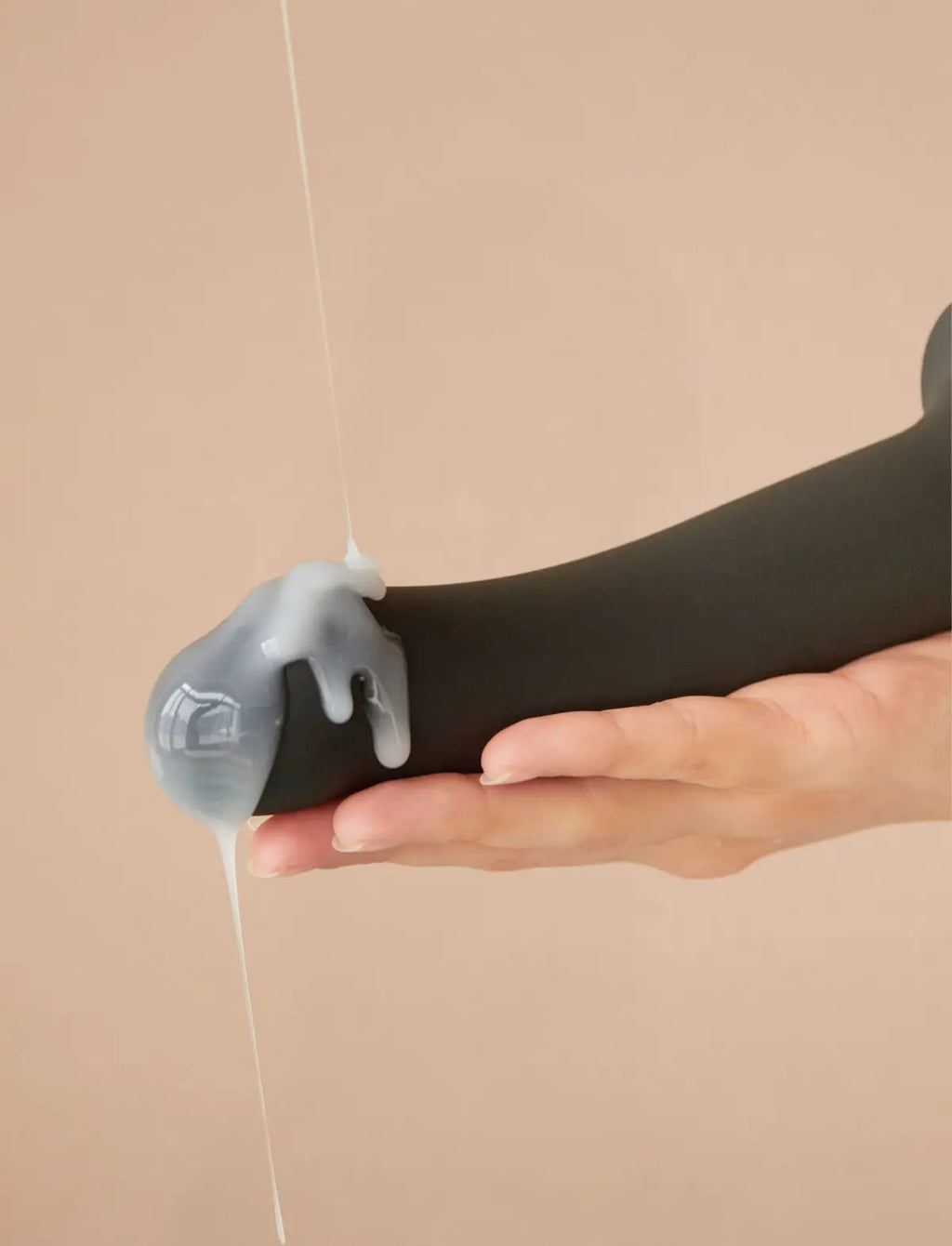 Ejaculating dildo Strap-on-Me in black with lifelike texture and ergonomic design for a realistic and comfortable use