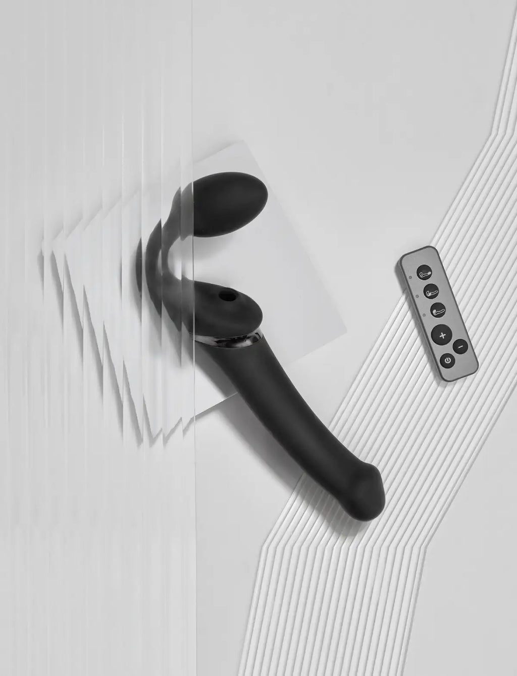 Rechargeable remote-controlled Strap-on-Me with 3 motors in black, designed for powerful performance and customizable vibration modes