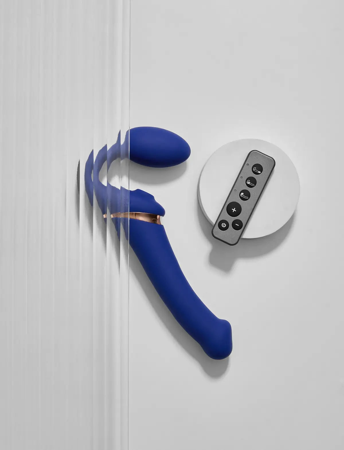 Rechargeable remote-controlled Strap-on-Me with 3 motors in blue, designed for powerful performance and customizable vibration modes
