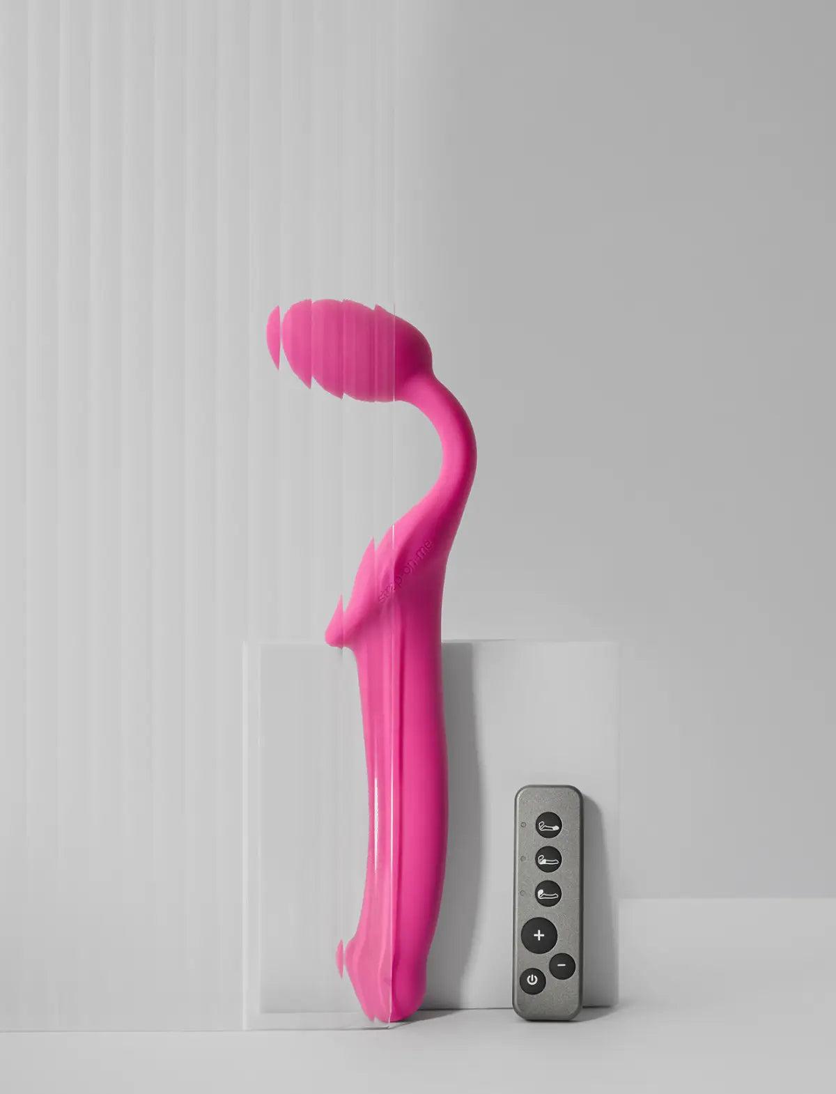 Rechargeable remote-controlled vibrating Strap-on-Me with 3 motors in fuchsia, designed for powerful performance and customizable vibration modes