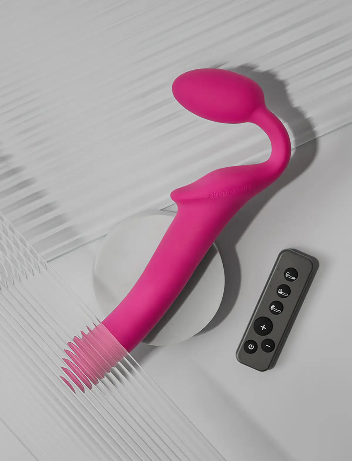 Rechargeable remote-controlled vibrating Strap-on-Me with 3 motors in fuchsia, designed for powerful performance and customizable vibration modes